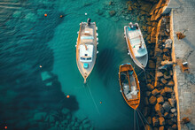 Aerial Drone Top Down Photo Of Traditional Fishing Boat Anchored Near Small Picturesque Port. Top View.