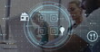 Image of cyber security text, barcode, sustainable icon, diverse coworker discussing over laptop
