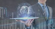 Image of globe and financial data processing over businessman holding tablet