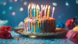 .Colorful celebration birthday cake with colorful birthday candles and sparklers against a blue background