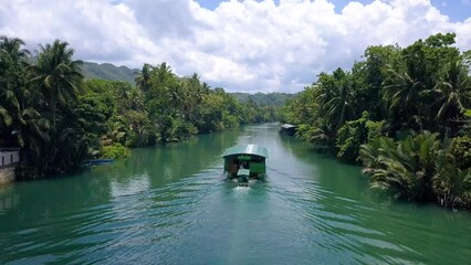 following one of the boats of the loboc river cruise, one of the popular attractions in bohol, phili