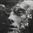black and white artistic portrait of a person submerged in water creating a dramatic effect