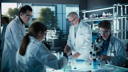 Leinwandbilder - Head of Laboratory Making a Bioengineering Experiment with a Group of Young Science College Students. Future Specialists Working with Modern Microscopes, Using Tablet and Laptop Computers
