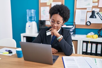 Poster - African american woman business worker using laptop and credit card at office