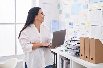 Canvas Print - Young beautiful hispanic woman business worker using laptop working at office