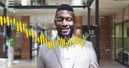 Sticker - Image of multiple graphs with changing numbers over smiling african american man