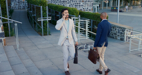 Wall Mural - Business men, phone call and talking in city on commute to work in metro with discussion, chat and walking. People, staff and employees with digital touchscreen, bag or advice with travel on sidewalk