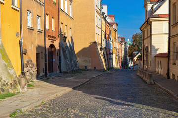 Wall Mural - Cityscape - view of narrow streets with colorful old houses in the Old Town of Warsaw, Poland