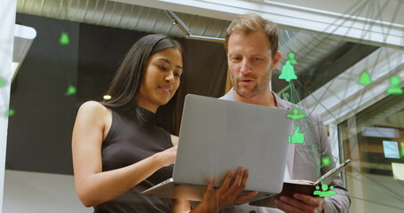 Poster - Image of connected computer icons forming globe over diverse coworkers analyzing data on laptop