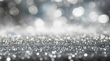  An Ethereal Abstract Silver Bokeh Background Shimmers With Radiant Light, Creating A Mesmerizing Display Of Depth And Texture. Delicate Silver Particles Dance And Twinkle Against A Dark Backdrop.