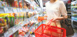 Asian woman consumer choosing asia food product at supermarket store