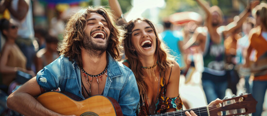 Wall Mural - Happy hippie couple playing music and singing with friends in the street, having fun during outdoor party on a sunny day.