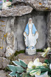 CZARNY DUNAJEC, POLAND - MARCH 29, 2024: Fatima Grotto with a statue of Our Lady in the garden of the church in Czarny Dunajec, Poland.