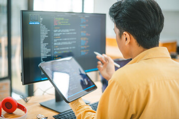 young programmer working on coding, software development and web design in software company office.c