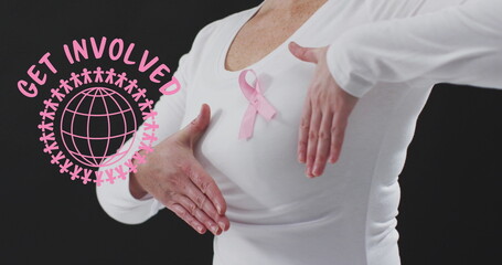 Wall Mural - Get involved text banner against mid section of woman wearing pink ribbon on her chest