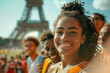 Smiling black woman standing in front of the Eiffel Tower