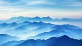 Fototapeta Dinusie - Serene blue mountain layers at sunrise