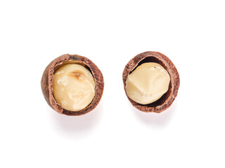 Wall Mural - two macadamia nuts with open shells isolated