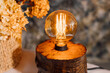 Table lamp made of wood. Edison electric lamp. Incandescent lamp.