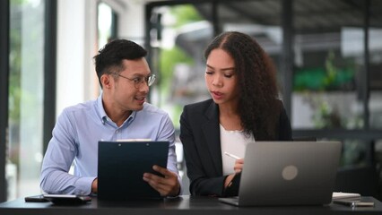 Portrait of success business people working together in modern office. Couple teamwork startup concept
