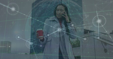 Sticker - Image of network of connections with globe over biracial woman using smartphone