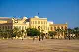 Fototapeta Zwierzęta - Isa Cultural Centre and plaza in Manama, Bahrain, with palm trees. It includes e.g. Historical Documents Centre, Shaikh Isa National Library, National Archives and cultural venues and halls.