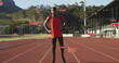 Image of notification bars, african american athlete standing arms on waist in race track
