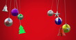 Image of tree, bell, star and baubles swinging against red background