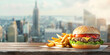 Cheeseburger and fries with cityscape background