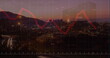 Image of financial graphs and data over timelapse with road traffic at sunset
