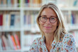 © mafsdisseny - Close-up portrait smiling woman teacher with glasses