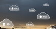 Image of clouds with electronic devices over landscape