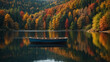 A boat sits calmly in a lake surrounded by trees with fall foliage.


