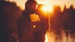 Silhouette of couple kissing under the warm glow of sunset, expressing love