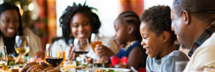 A diverse group of individuals gathered around a table sharing a meal. Various dishes and drinks are present as they engage in conversation and laughter