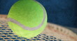 Image of tennis racket and ball on blue background