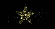 Image of dots floating over golden star on black background