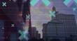 Image of floating x icons and multicolored graphs over low angle view of buildings in city