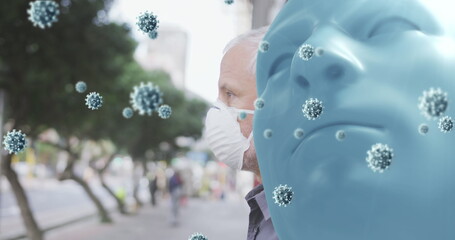 Sticker - Image of covid 19 cells over blue face and caucasian man wearing face mask