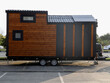 © Maxim Chuev - Mobile tiny house, great for outdoor experiences and holidays.  mobility and pure adventure. construction of a mini house. relocated on city. House on wheels. motor home. caravan. solar panels on roof