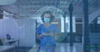 Image of globe and data processing over businesswoman in face mask in office using tablet