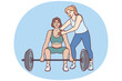 Strong athlete lifts heavy barbell under supervision of personal trainer from gym teaching ward before competition. Bodybuilding trainer supports sportswoman doing pulling exercise in fitness club