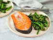 Ready-to-eat grilled salmon steak and greens