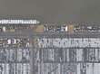 Aerial top down drone views of transportation of vehicles over seas from a sea port terminal, specifically the Zeebrugge, intermodal logistics, roll on roll off cargo, and loading unloading of new