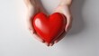 © Yliya - women's hands hold the heart, the concept of the International Day of Medicine