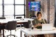 © Wavebreak Media - Asian middle-aged woman checking smartphone in modern business office