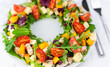 A healthy salad made from chicken, green vegetables and fruits. Close-up. Selective focus.