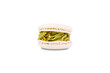 Macaron with with pistachio flavor isolated on a white background. Close-up.