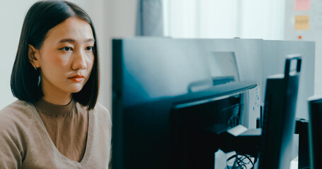 Young adult Asia female freelance typing write prompt AI bot IT app smart program nomad, video game, terminal with coding language, user interface, designer, big data center on desktop computer.