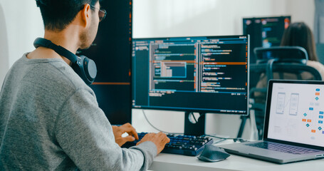 Closeup Adult Asia male, female freelance typing write prompt AI bot IT app smart program nomad, video game, terminal with coding language, user interface, designer, big data center desktop computer.